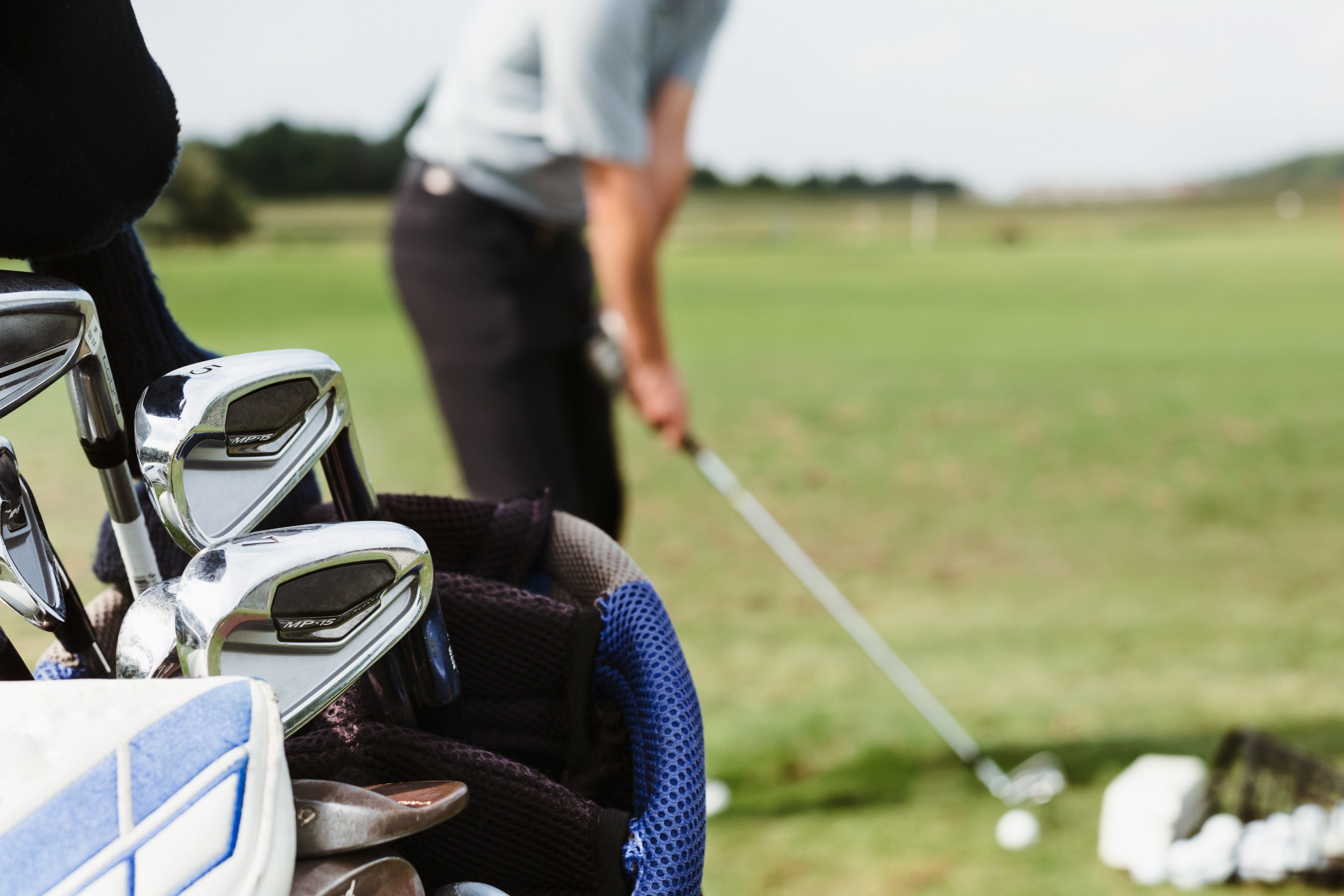 golfer-lines-up-at-driving-range.jpg